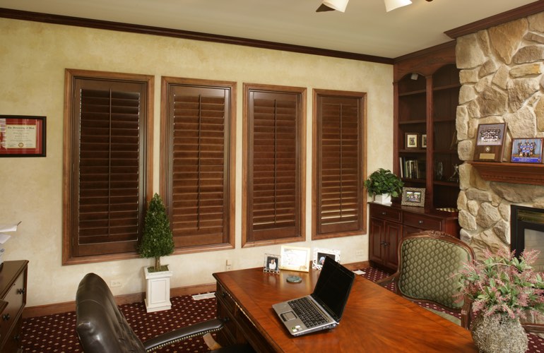 Wooden plantation shutters in a New York home office